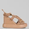 SANDALI ALTI IN PELLE INTRECCIATA CON ZEPPA