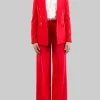 TAILLEUR ROSSO CON GIACCA DOPPIOPETTO E PANTALONI FLARE